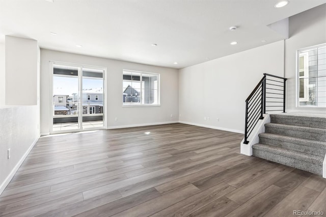 unfurnished living room featuring dark hardwood / wood-style flooring