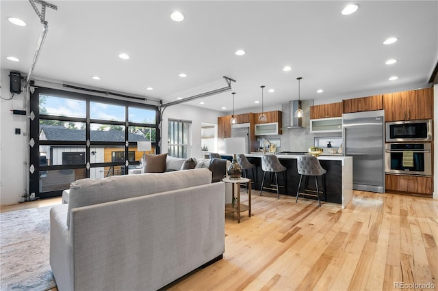 living room with light hardwood / wood-style flooring