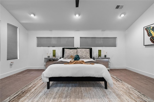 bedroom featuring vaulted ceiling and carpet flooring