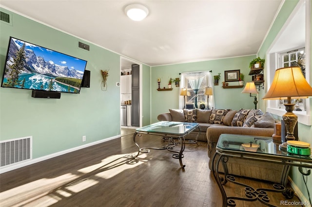 living room with ornamental molding and wood-type flooring