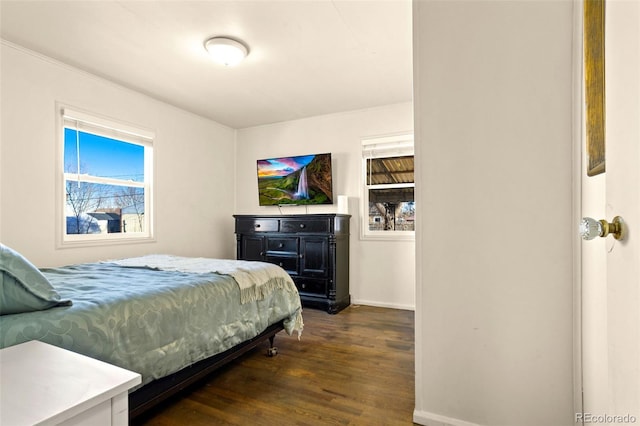 bedroom with dark wood-type flooring