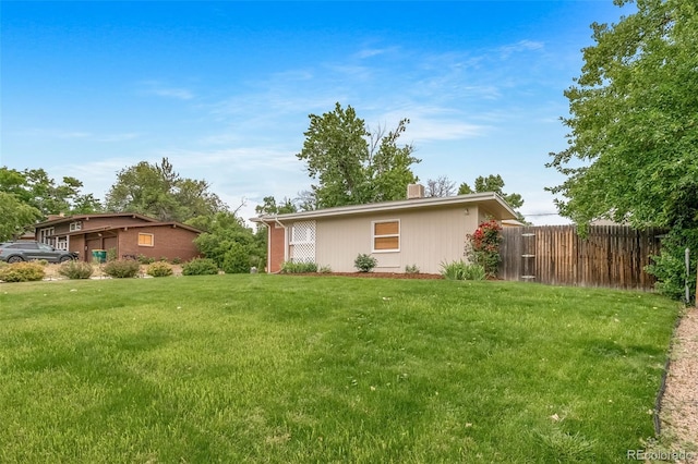 8051 S Kendall Blvd, Littleton, CO 80128 - back of property featuring a chimney
