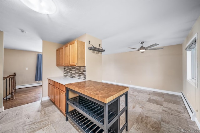 8051 S Kendall Blvd, Littleton, CO 80128 - kitchen featuring a baseboard radiator, a baseboard heating unit, ceiling fan, tasteful backsplash, and light countertops