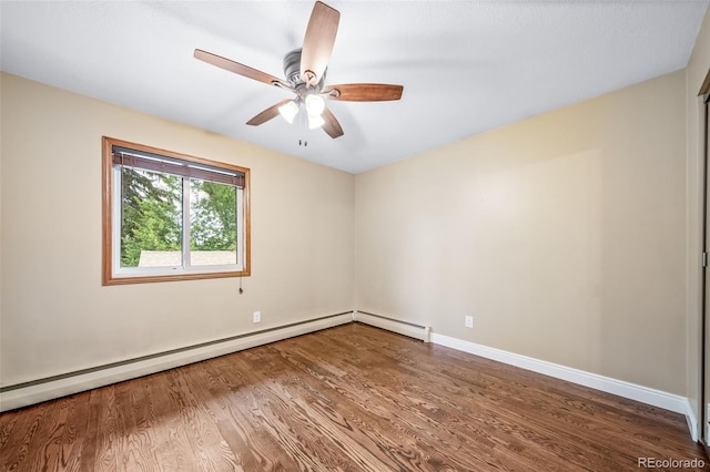 8051 S Kendall Blvd, Littleton, CO 80128 - spare room featuring wood finished floors, baseboard heating, and ceiling fan