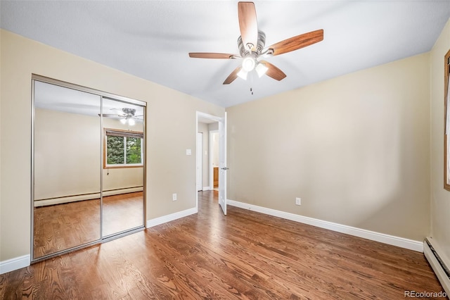 8051 S Kendall Blvd, Littleton, CO 80128 - unfurnished bedroom with a baseboard heating unit, baseboard heating, wood finished floors, a closet, and ceiling fan