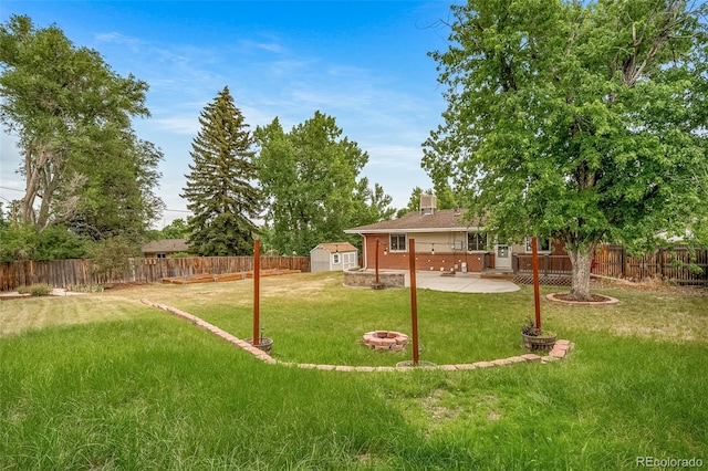 8051 S Kendall Blvd, Littleton, CO 80128 - fenced backyard with a patio and a shed