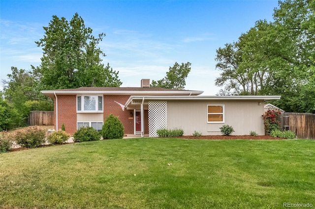 8051 S Kendall Blvd, Littleton, CO 80128 - view of front facade featuring brick siding