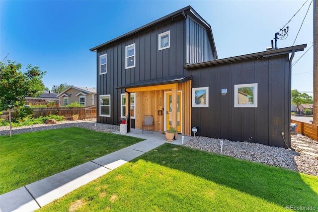 550 S Raleigh St, Denver, CO 80219 - rear view of property with board and batten siding