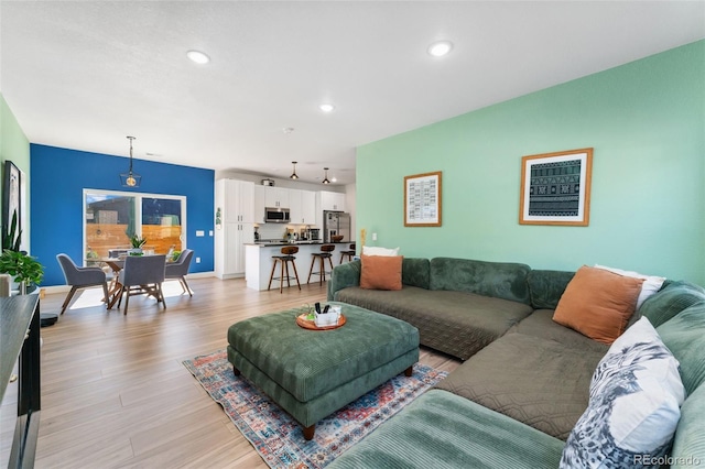 550 S Raleigh St, Denver, CO 80219 - living area featuring light wood-type flooring and recessed lighting
