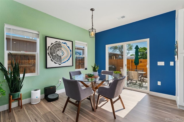 550 S Raleigh St, Denver, CO 80219 - dining area featuring wood finished floors and baseboards