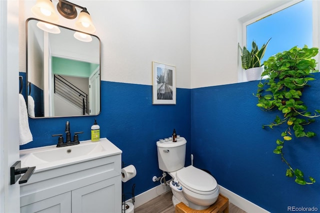 550 S Raleigh St, Denver, CO 80219 - bathroom with vanity and wood finished floors