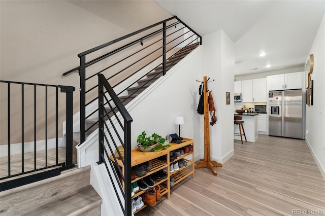 550 S Raleigh St, Denver, CO 80219 - stairway with wood finished floors and recessed lighting