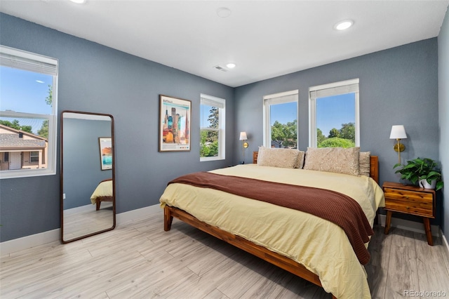 550 S Raleigh St, Denver, CO 80219 - bedroom featuring light wood-style flooring and recessed lighting