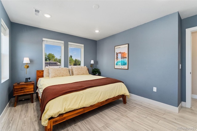 550 S Raleigh St, Denver, CO 80219 - bedroom with light wood-style flooring and recessed lighting