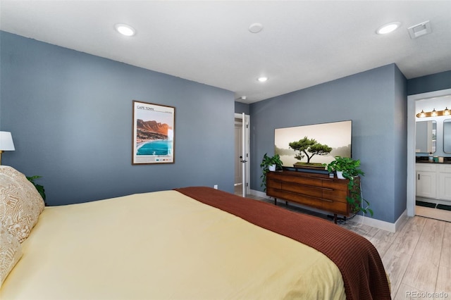 550 S Raleigh St, Denver, CO 80219 - bedroom featuring light wood-style floors, recessed lighting, and connected bathroom