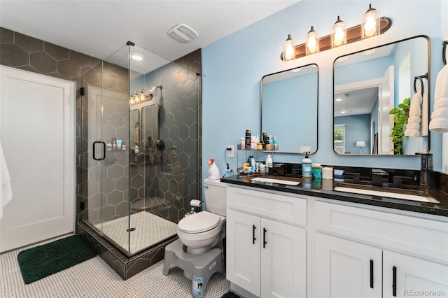 550 S Raleigh St, Denver, CO 80219 - bathroom with vanity, a stall shower, and tile patterned floors