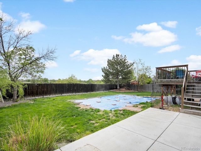 view of yard with a patio, a deck, and stairway