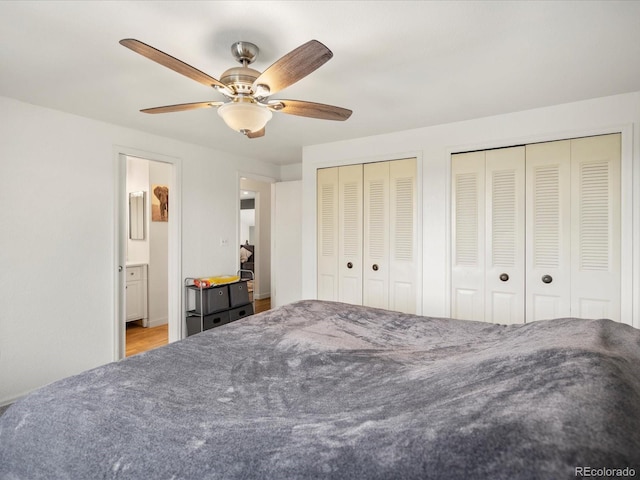 bedroom featuring multiple closets and ceiling fan