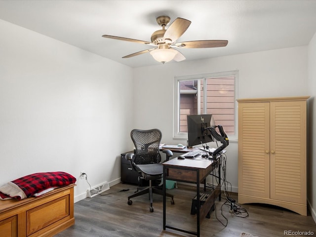 office featuring ceiling fan, wood finished floors, and baseboards
