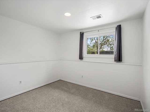 carpeted empty room with baseboards and recessed lighting