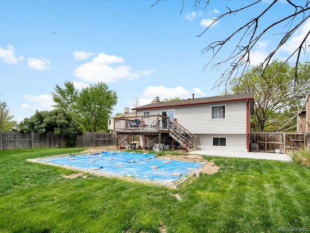 back of house with stairs, a deck, and a patio area