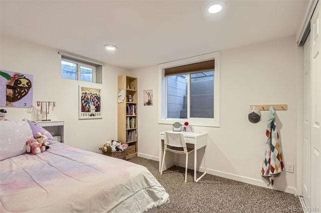 carpeted bedroom featuring baseboards, recessed lighting, and a closet