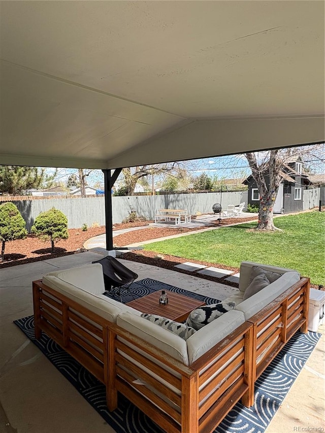 view of patio with fence and an outdoor hangout area