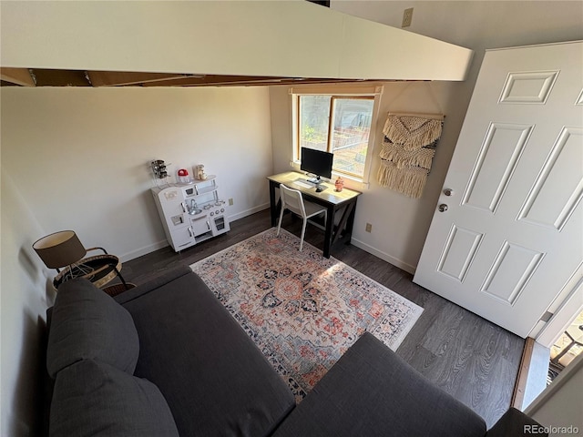 home office with baseboards and dark wood-style floors