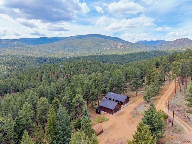 54 Zaza Ln, Evergreen, CO 80439 - view from above of property with a heavily wooded area and a mountain backdrop