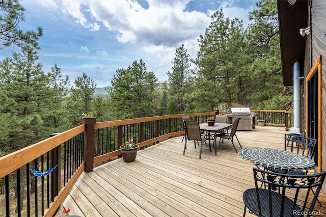 54 Zaza Ln, Evergreen, CO 80439 - wooden terrace featuring outdoor dining area and area for grilling