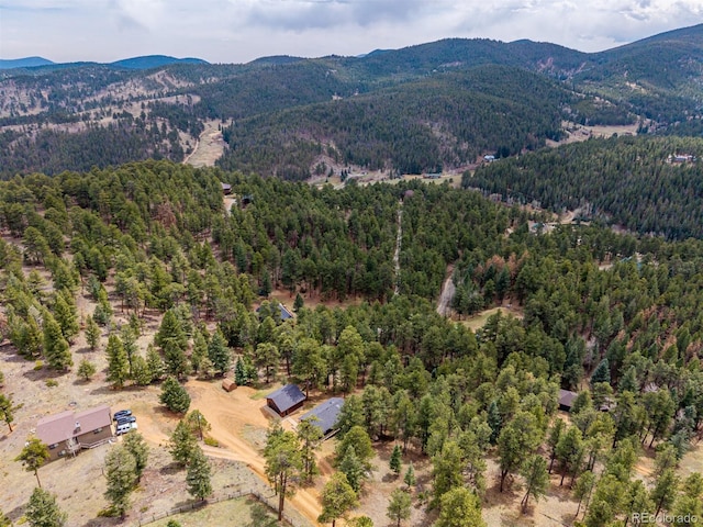 54 Zaza Ln, Evergreen, CO 80439 - aerial view of a heavily wooded area and a mountain backdrop