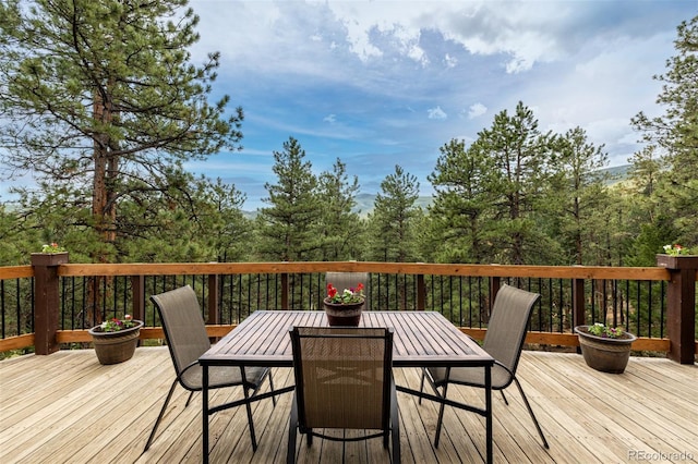 54 Zaza Ln, Evergreen, CO 80439 - wooden terrace featuring outdoor dining area