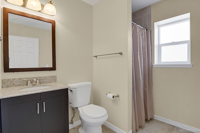 243 Madison Dr, Bennett, CO 80102 - full bath with a shower with curtain, baseboards, toilet, and vanity