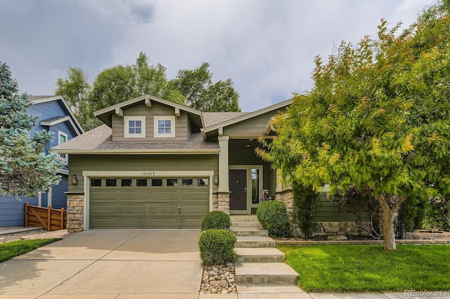 10463 Nucla St, Commerce City, CO 80022 - craftsman-style house featuring concrete driveway, roof with shingles, and stone siding