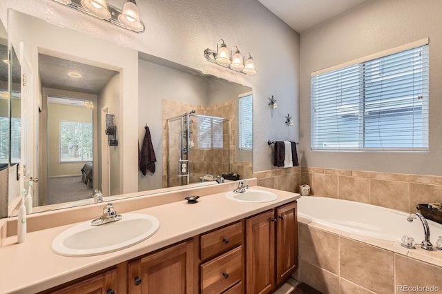 10463 Nucla St, Commerce City, CO 80022 - full bathroom with a bath, a shower stall, and double vanity