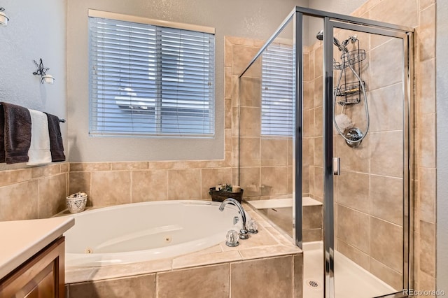 10463 Nucla St, Commerce City, CO 80022 - full bath with a whirlpool tub, a stall shower, and vanity