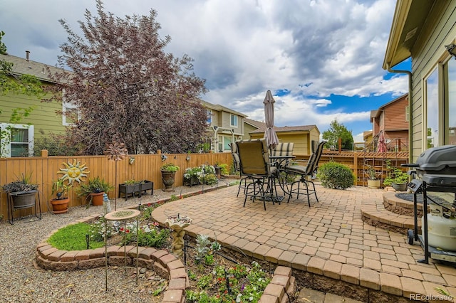 10463 Nucla St, Commerce City, CO 80022 - fenced backyard featuring a patio, grilling area, and outdoor dining area