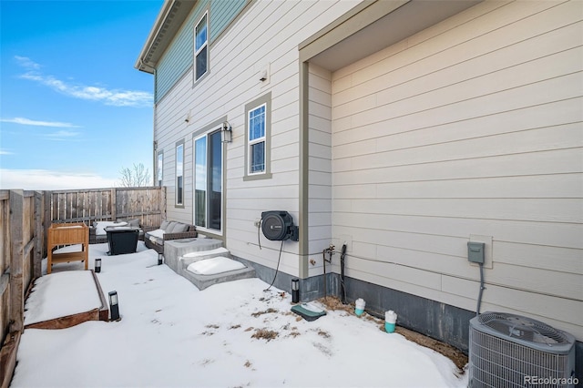 exterior space with central air condition unit, an outdoor hangout area, and fence