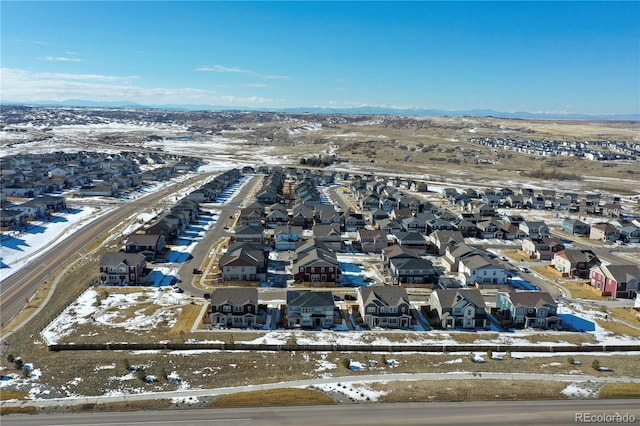 snowy aerial view featuring a residential view