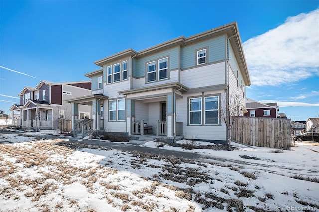 townhome / multi-family property featuring a residential view and fence