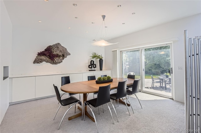 dining space with light carpet