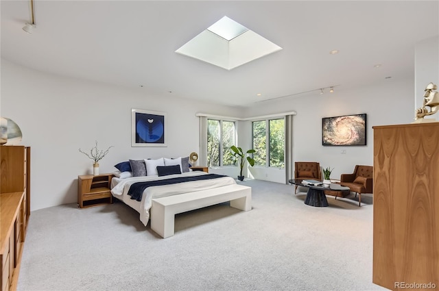 carpeted bedroom featuring a skylight