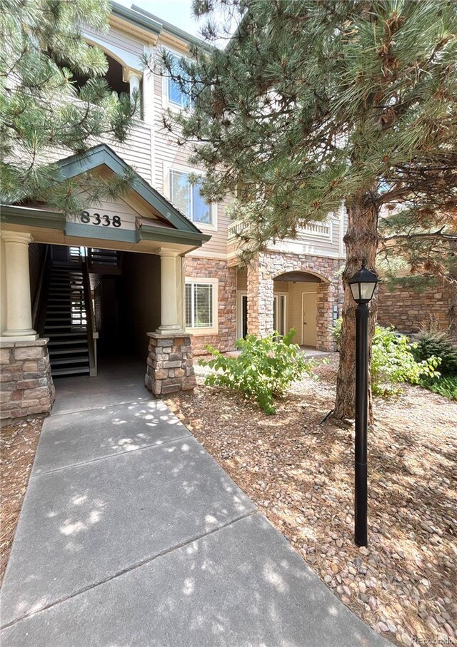 8338 S Independence Cir Unit 104, Littleton, CO 80128 - view of front of home with stone siding