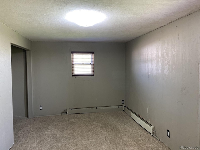 carpeted empty room with a textured ceiling