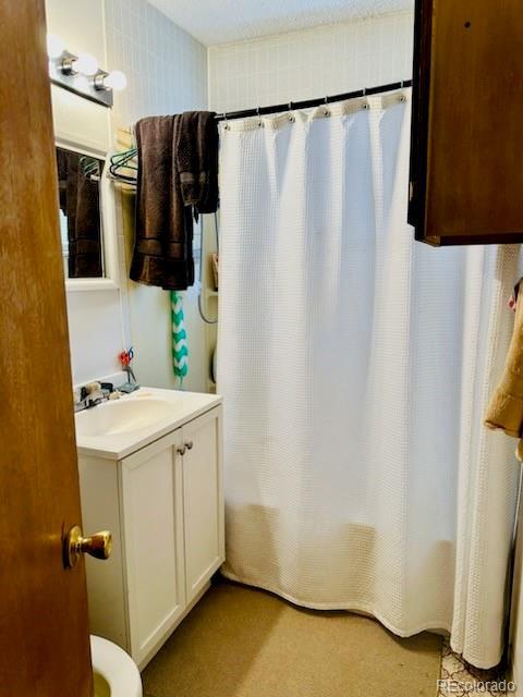 bathroom with vanity and shower / tub combo