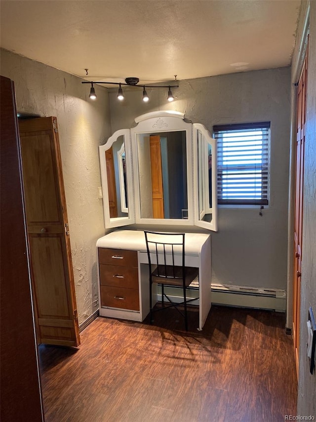 bathroom with wood-type flooring and rail lighting