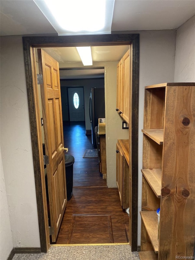 hallway with dark wood-type flooring