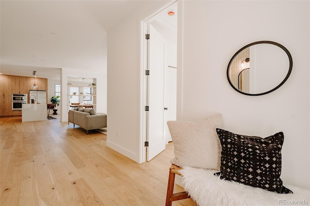 2530 Chase, Edgewater, CO 80215 - corridor featuring light wood-style flooring and baseboards