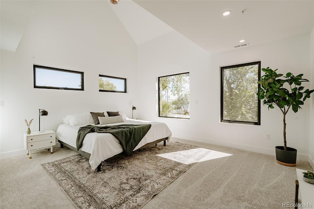 2530 Chase, Edgewater, CO 80215 - carpeted bedroom with high vaulted ceiling, baseboards, and recessed lighting