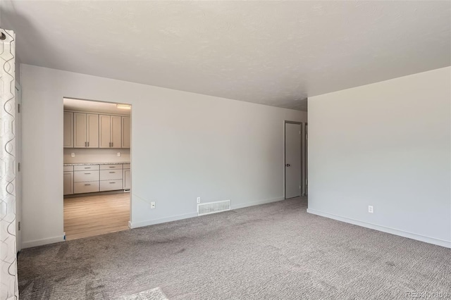 1785 S Zuni St, Denver, CO 80223 - unfurnished room featuring light carpet and baseboards